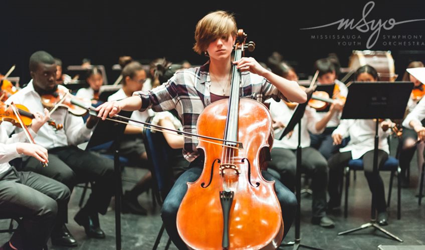 A musician in the MYSO playing a cello.