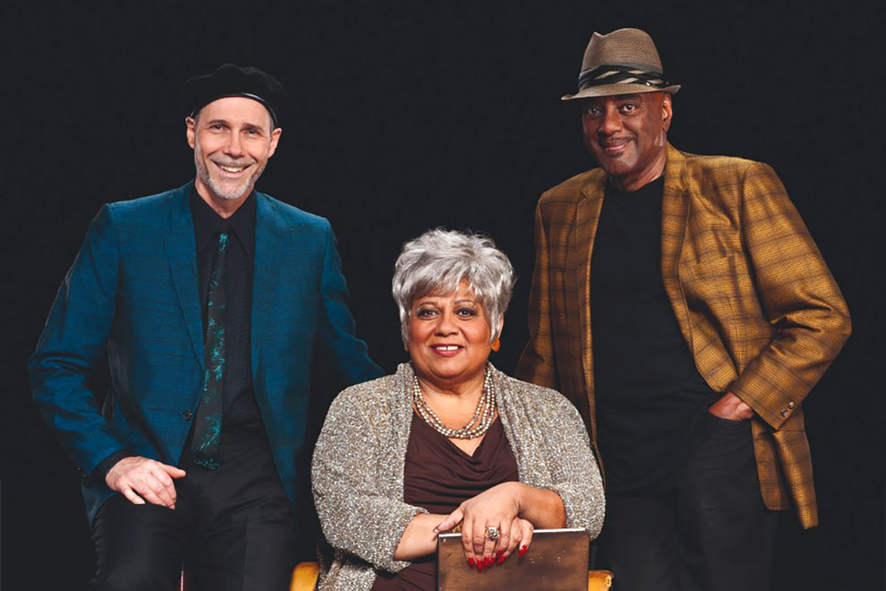 A group photo of Joe Sealy, Jackie Richardson and the Nathaniel Dett Chorale.