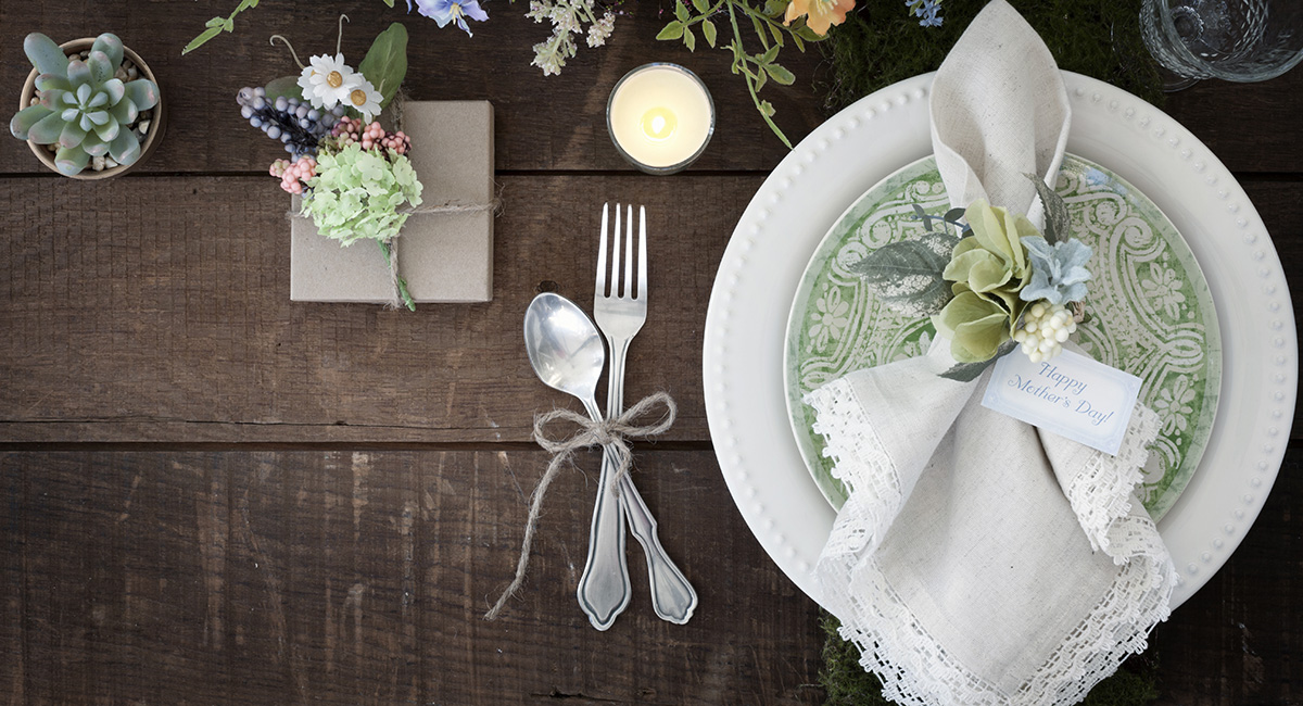 A special Mother's Day table setting with white napkins.