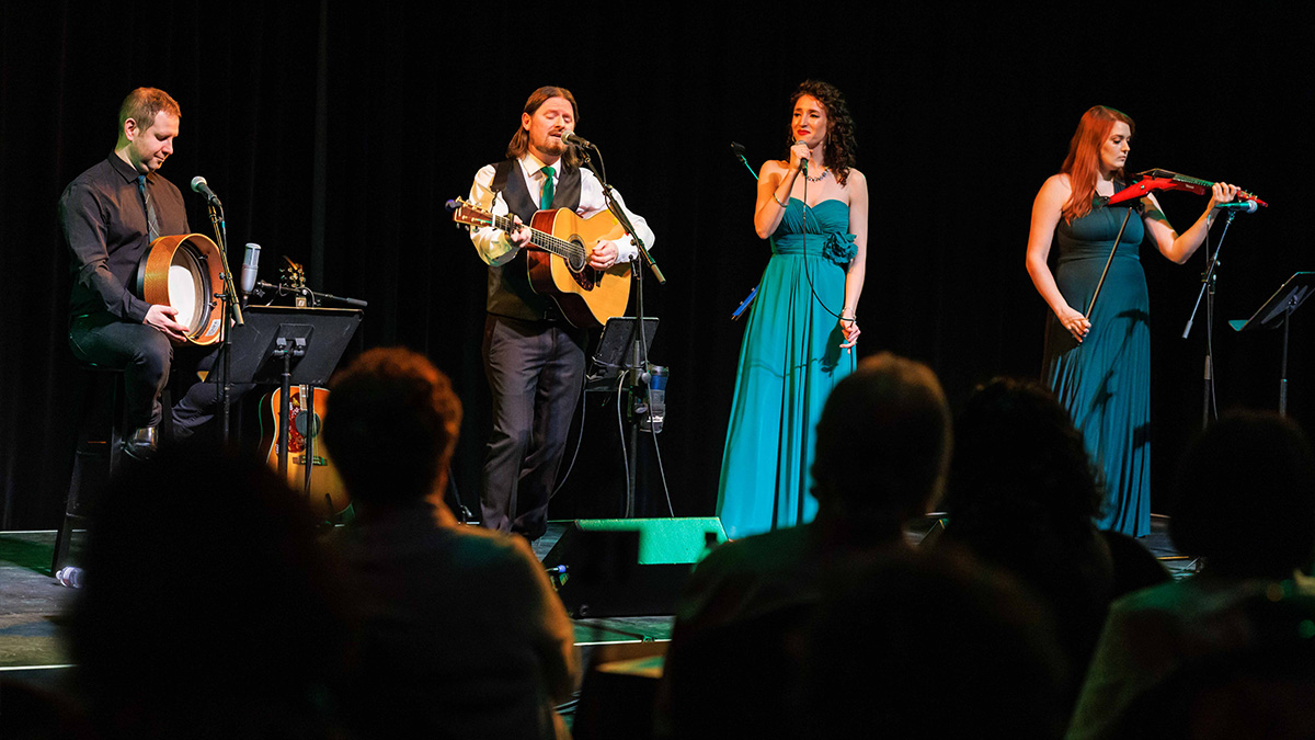 Celtic Roots performing on stage