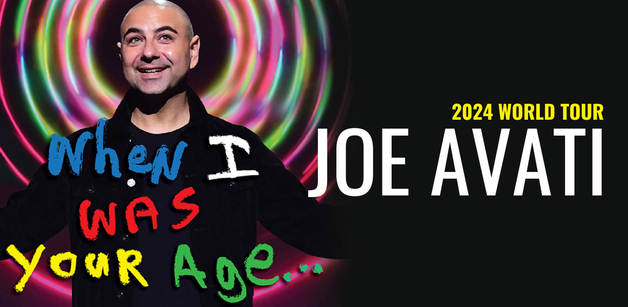 Joe Avati performing on stage.