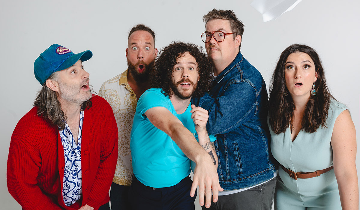 The Strumbellas throwing a paper airplane