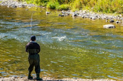 Someone standing by Credit River Shore fishing