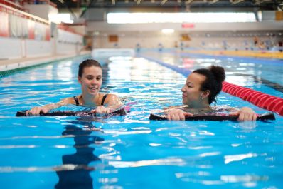 Water aerobics class in a swimming pool.