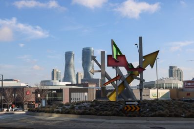 Large colourful metal sculpture on a round-about in front of Square One Shopping Centre