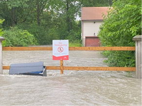 Mississauga flooding on July 16, 2024 of Cooksville Park with water almost reaching the bottom of a sign.