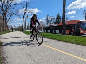 Person riding bike on a multi-use trail