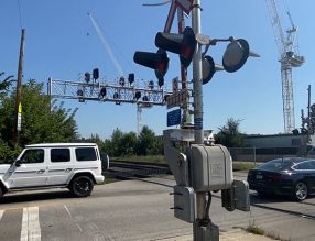 Vehicles driving across designated railway crossings.