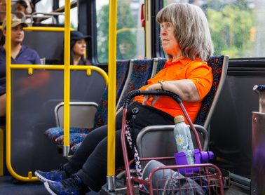 A person sitting on a bus.