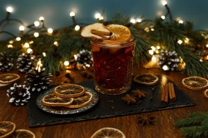 Mulled wine in glass on table for Christmas celebration