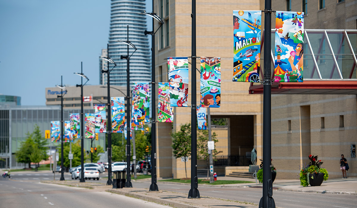 A series of light poles with vinyl banners.