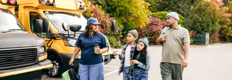 Mon and Dad walking kids to school