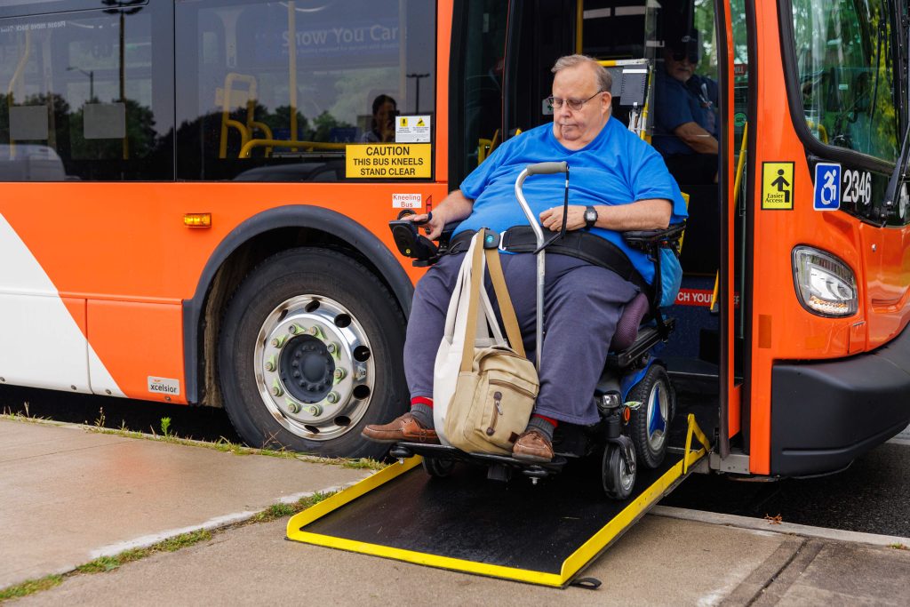 Customer exiting the bus ramp on a wheelchair